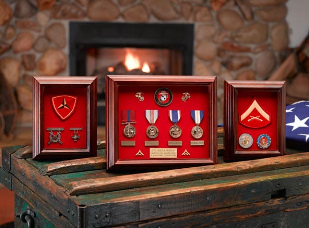 set-of-medals-in-shadow-boxes-before-fireplace