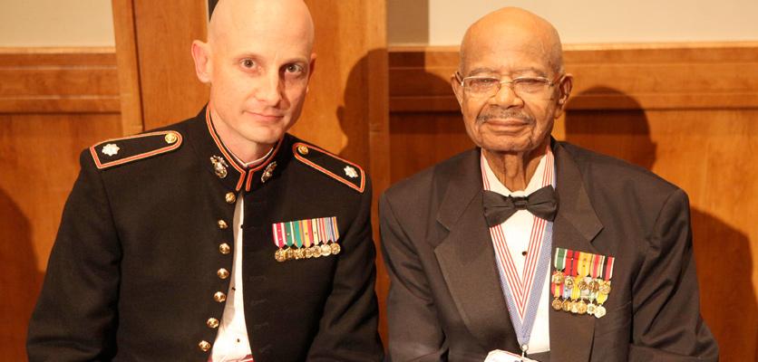 pair of men wearing miniature medals