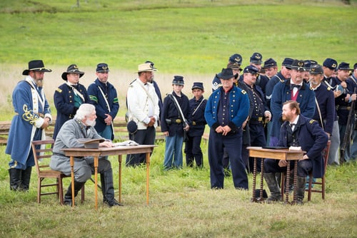 Union and confederate soldiers reenact the Battle of Gettysburg