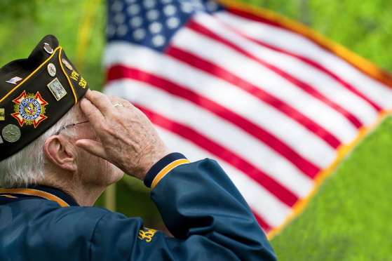 Veteran Saluting the American Flag